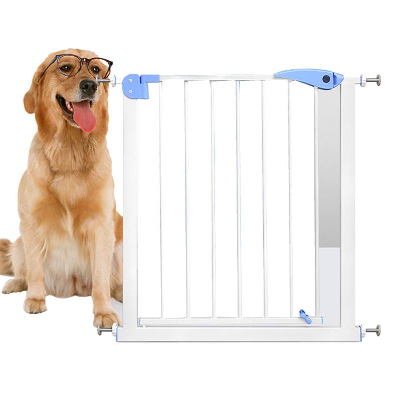 A dog is standing behind the pet safety gate.